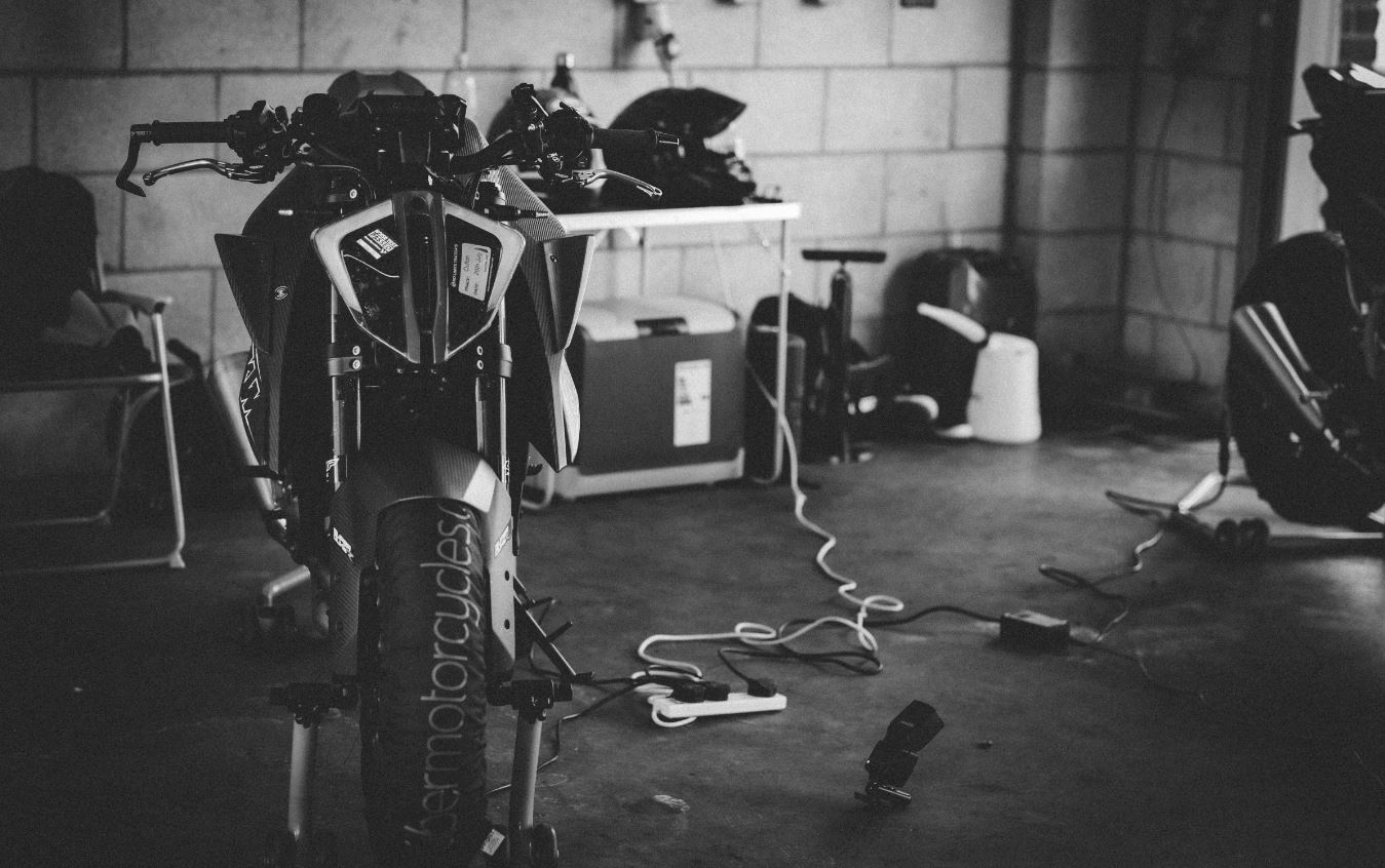 KTM 1290 superduke in the pits at Oulton Park in black and white